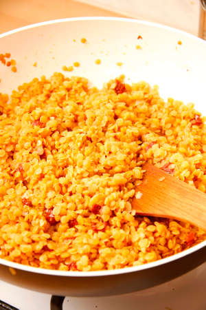 Sauteed quinoa in white bowl in the kitchenの写真素材