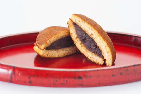 Japanese Dorayaki cake with red bean filling on bambo trayの写真素材