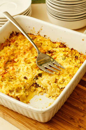 Paste farfalle pudding pumpkin puree on tableの写真素材