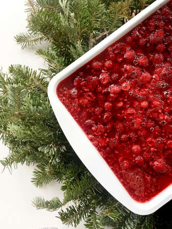 Rasberry  pretzel delight with pine leaves on white backgroundの写真素材