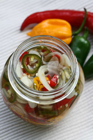 Fermented garlic and chili in glass bottleの写真素材
