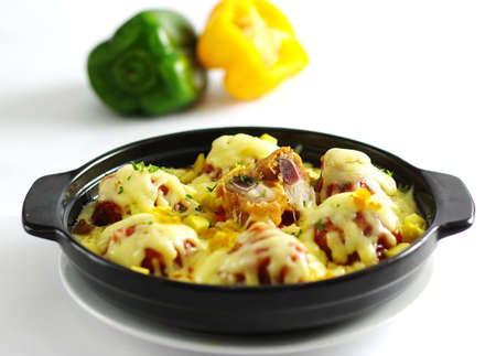 Hot chili pork ribs baked with cheese in black stewの写真素材