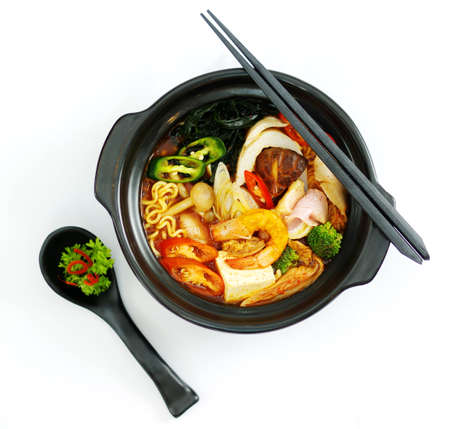 Hot chili ramen noodle with seafood in black stewの写真素材