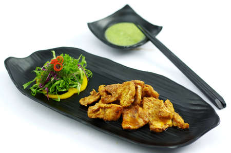 Grilled crocodile with butter chili sauce and saladの写真素材