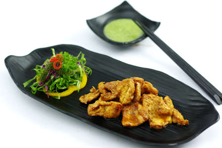 Grilled crocodile with butter chili sauce and saladの写真素材