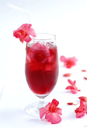 Glass of fresh orchird tea on white backgroundの写真素材
