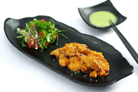 Grilled crocodile with butter chili sauce and saladの写真素材