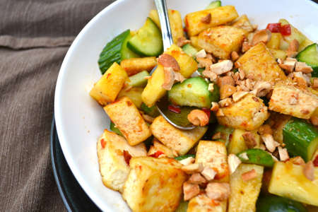 Rojak salad with tofu, cucumber and cashewの写真素材