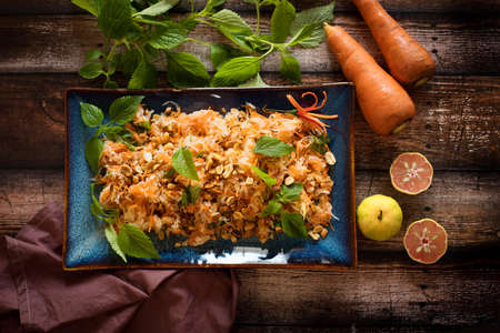 Kohlrabi  Carrot Salad with peanuts, lemon and herbsの写真素材