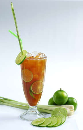 Glass of fresh lime tea with lemongrass on white backgroundの写真素材