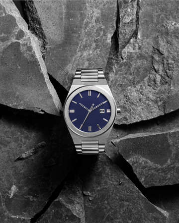 Men watch breaks rocks banner advertising product conceptual