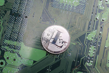 Litecoin digital cryptocurrency physical coin silver computer boardの写真素材
