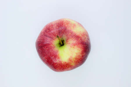 Beautiful red juicy apple located on a gray backgroundの写真素材