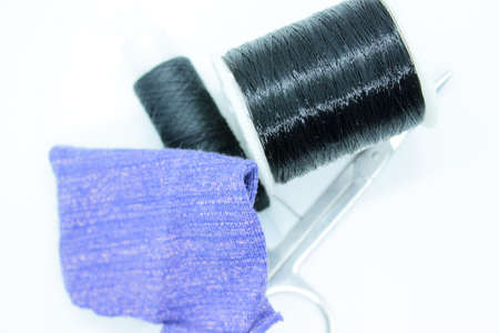 Black thread snort stools fabric arranged on a white backgroundの写真素材