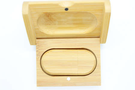 Wooden flash memory is located on a white backgroundの写真素材