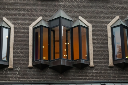 Windows in the braun bricks wall in Dortmund, Germany