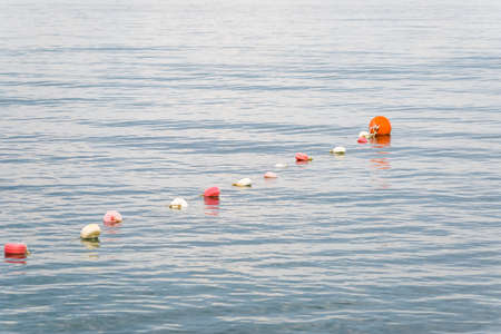 Closeup of bobbers at the sea at the evening