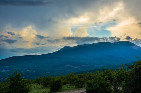 Sunset view on mountain and cloudy sky in Crimeaの写真素材