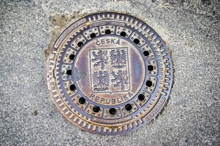 Hatch of sewage on the paving road in Tabor Czech Republicの写真素材
