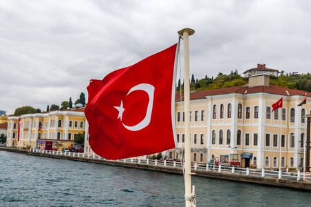 Flag of Turkey on Bosphorus background at autumn day