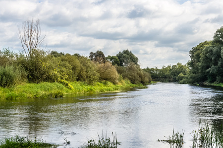 View on river in countryside at sunny day