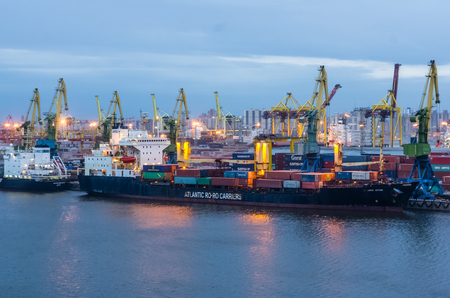 SAINT-PETERSBURG, RUSSIA - APRIL 17: Evening view on sea port, ships and cranes at April 17, 2016 in Saint-Petersburg, Russiaのeditorial素材