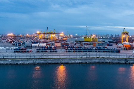 SAINT-PETERSBURG, RUSSIA - APRIL 17: Evening view on sea port, ships and cranes at April 17, 2016 in Saint-Petersburg, Russiaのeditorial素材
