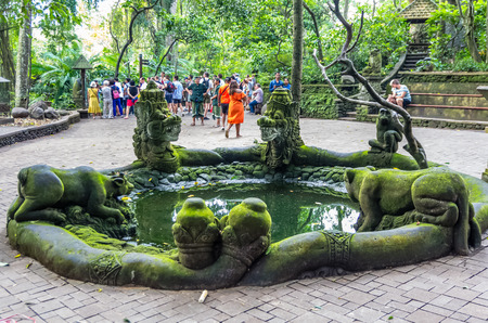UBUD, BALI, INDONESIA - SEPTEMBER 07: Pond with statue in Sacred Monkey Forest at September 07, 2018...