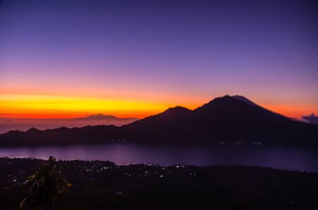 Amazing panorama view on sunrise and mountain from summit of Batur volcano, Bali, Indonesiaの写真素材