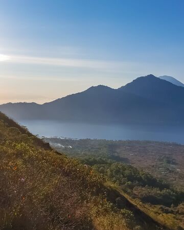 Morning panorama view on mountain from summit of Batur volcano, Bali, Indonesiaの写真素材