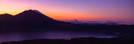 Amazing panorama view on sunrise and mountain from summit of Batur volcano, Bali, Indonesiaの写真素材