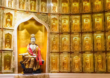 SANYA, HAINAN, CHINA - OCTOBER 10: Goddess Guanin gold statue in the Guanin temple in the Buddhist center Nanshan at October 10, 2019 in Sanya, Hainan, Chinaのeditorial素材