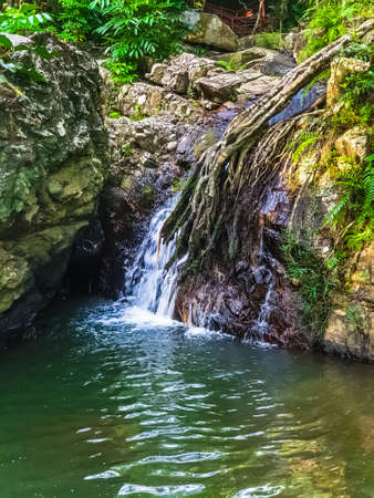 Waterfall and mountaina river in the Yanoda Rainforest Cultural Tourism Zone, Hainan, China