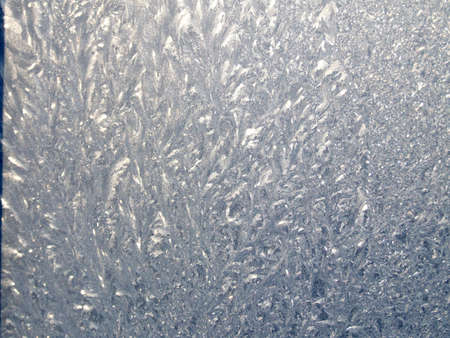 Frosty natural pattern on winter window. Background.の写真素材