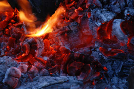 Fire coals after wooden camp fire.の写真素材