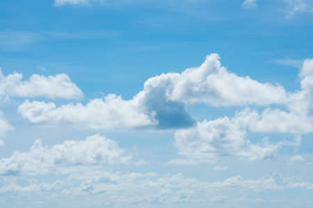 Beautiful blue sky with a fluffy cloudsの写真素材