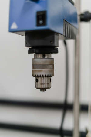 hand with gray glove using laboratory equipmentの写真素材