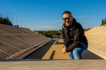 Man with sunglasses at Panathenaic Stadium in Athens, Greece.の写真素材