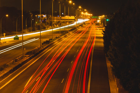 Night car light trails on Kifisos highway in Athens, Greece.