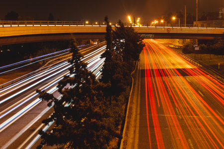 Night long exposure on Kifisos highway with bridge in Athens, Greece.