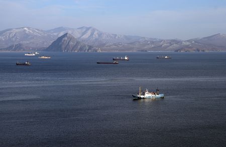 Old trawler in a winter bay.の写真素材
