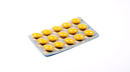 Packing of tablets on a white backgroundの写真素材