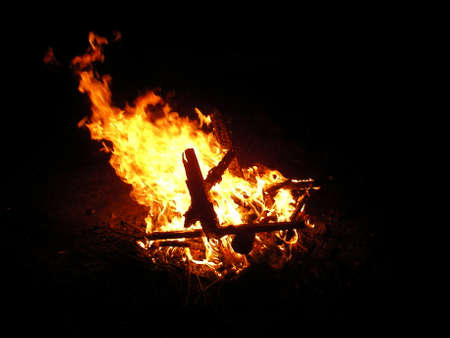 The night fire burns and smokes burning everything on the wayの写真素材