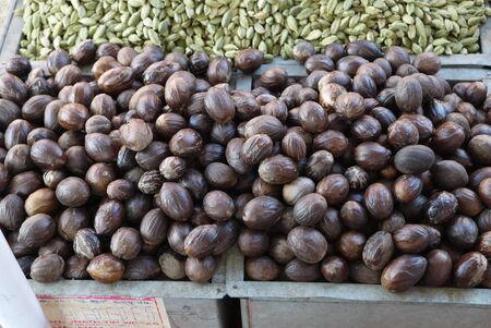 sale of a nutmeg and green cardamom in the Asian market