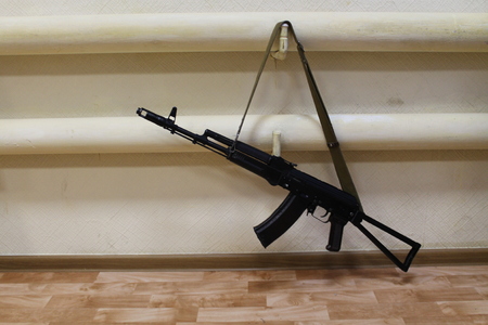the gun hangs on a pipe of steam heating