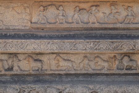 Bas-reliefs of old Hampi on walls of templesの写真素材