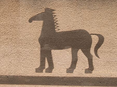 The stylized image of a horse on a wall from sandstoneの写真素材
