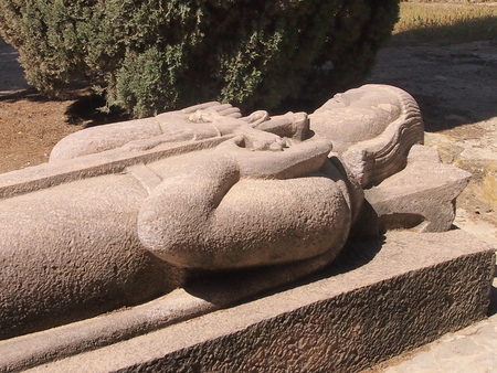 Stone gravestone in Carthage with the crucified Christ on a breastの写真素材