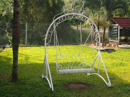 Openwork figurative iron swing for an entertainment of childrenの写真素材