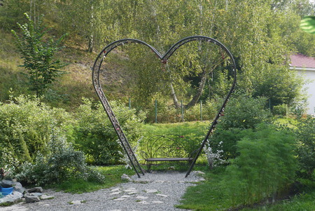 Wooden bench in the park with a shod iron ornamentの写真素材